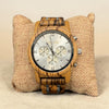 Retro X zebra wood chronograph watch with silver dial, roman numerals, three subdials, date window and silver-tone pushers, shown on a burlap pillow